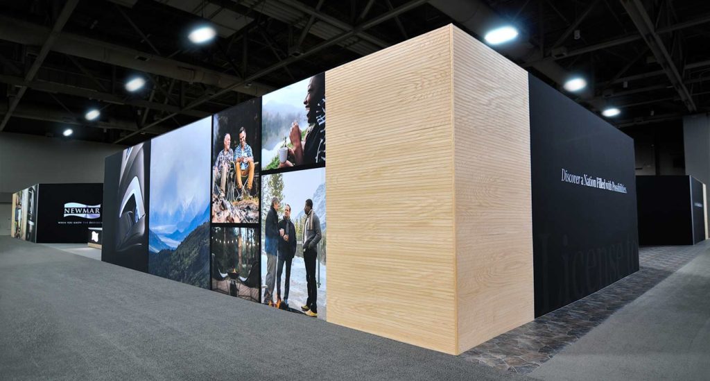 Newmar custom RV exhibit display with lifestyle wall graphics