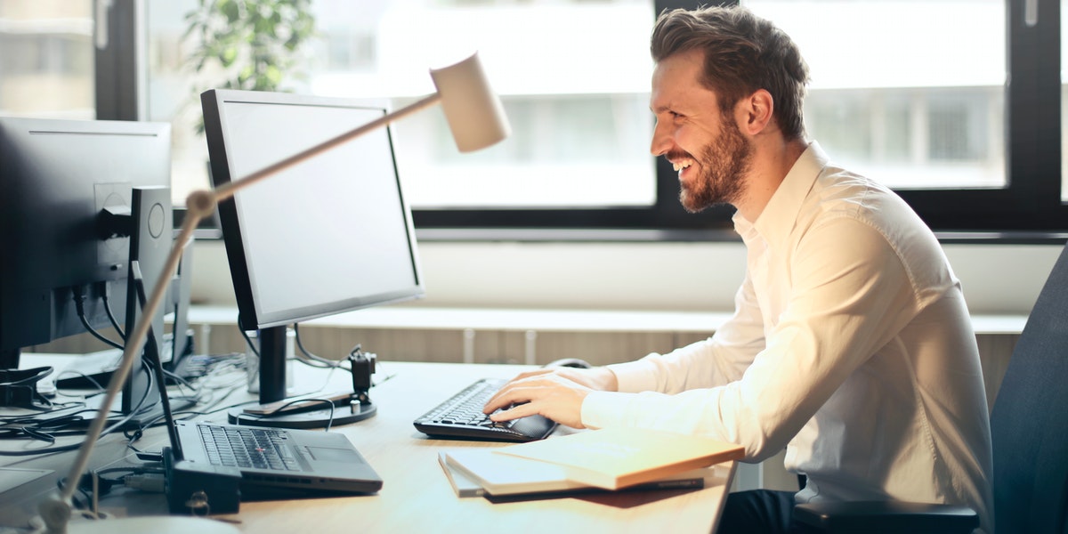 man networking on computer